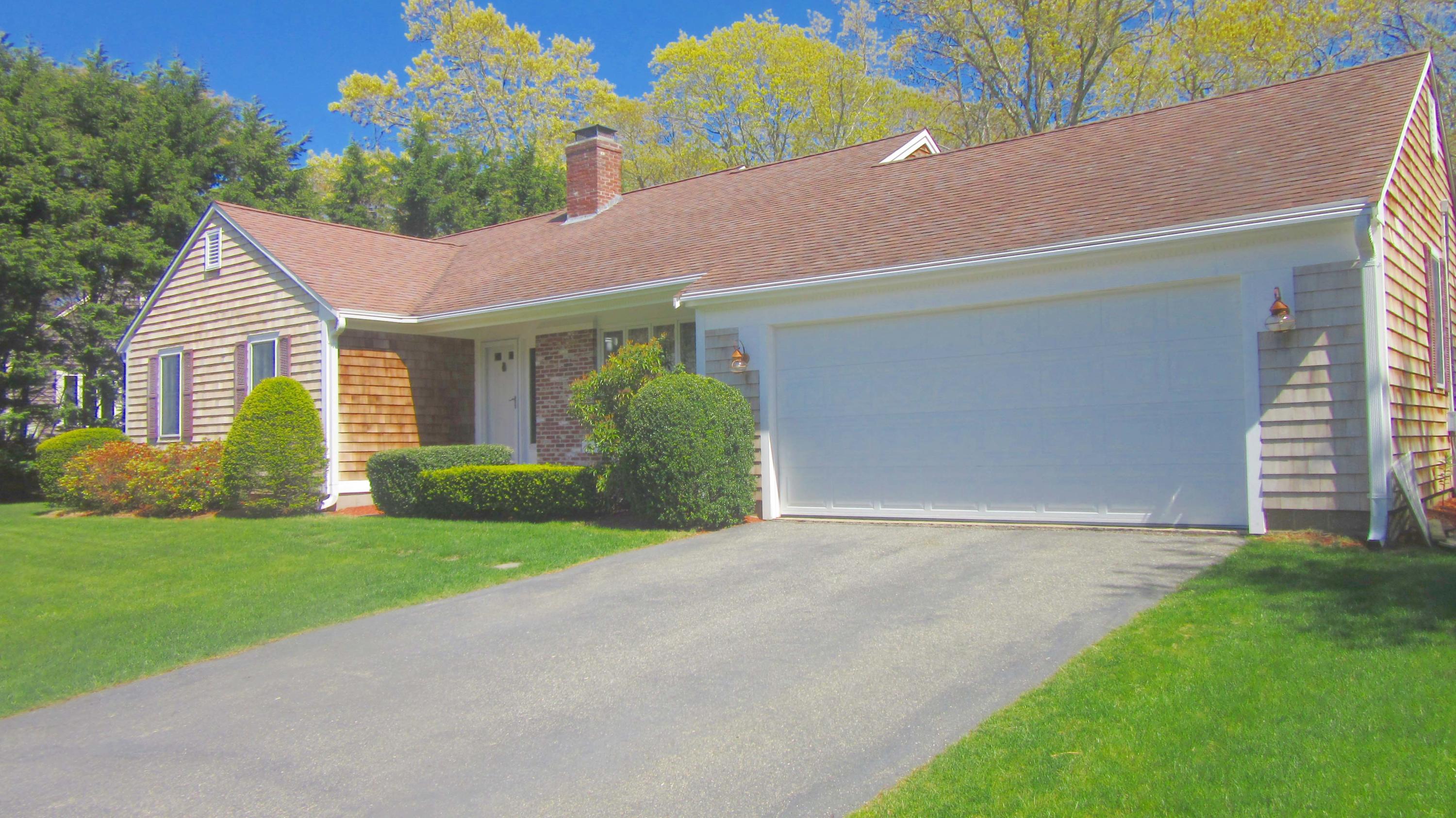 114 Sullivan Road West Yarmouth, MA 02673 - Photo 1 of 41 a front view of house with yard and green space