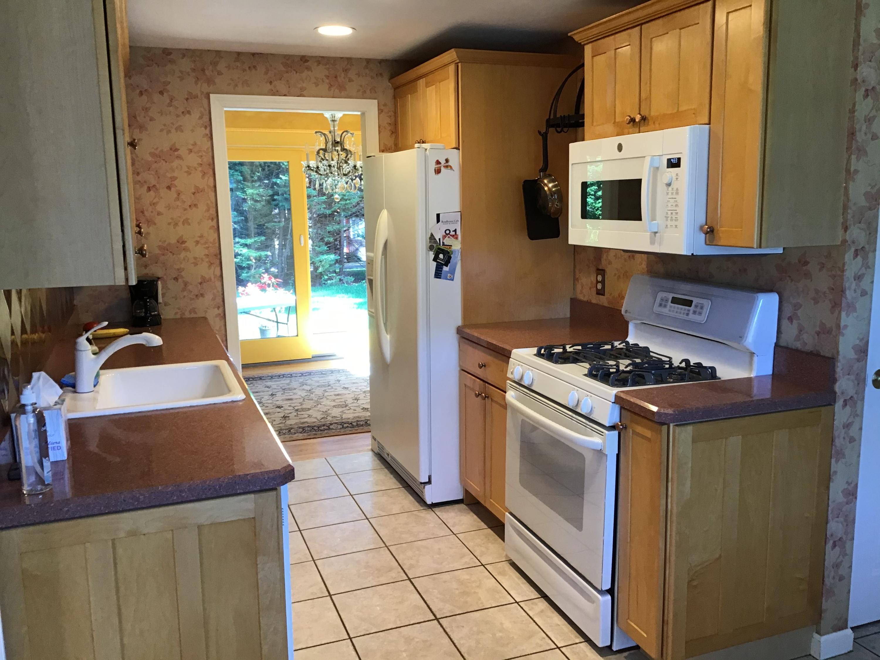 114 Sullivan Road West Yarmouth, MA 02673 - Photo 17 of 41 a kitchen with stainless steel appliances granite countertop a stove a sink and a refrigerator