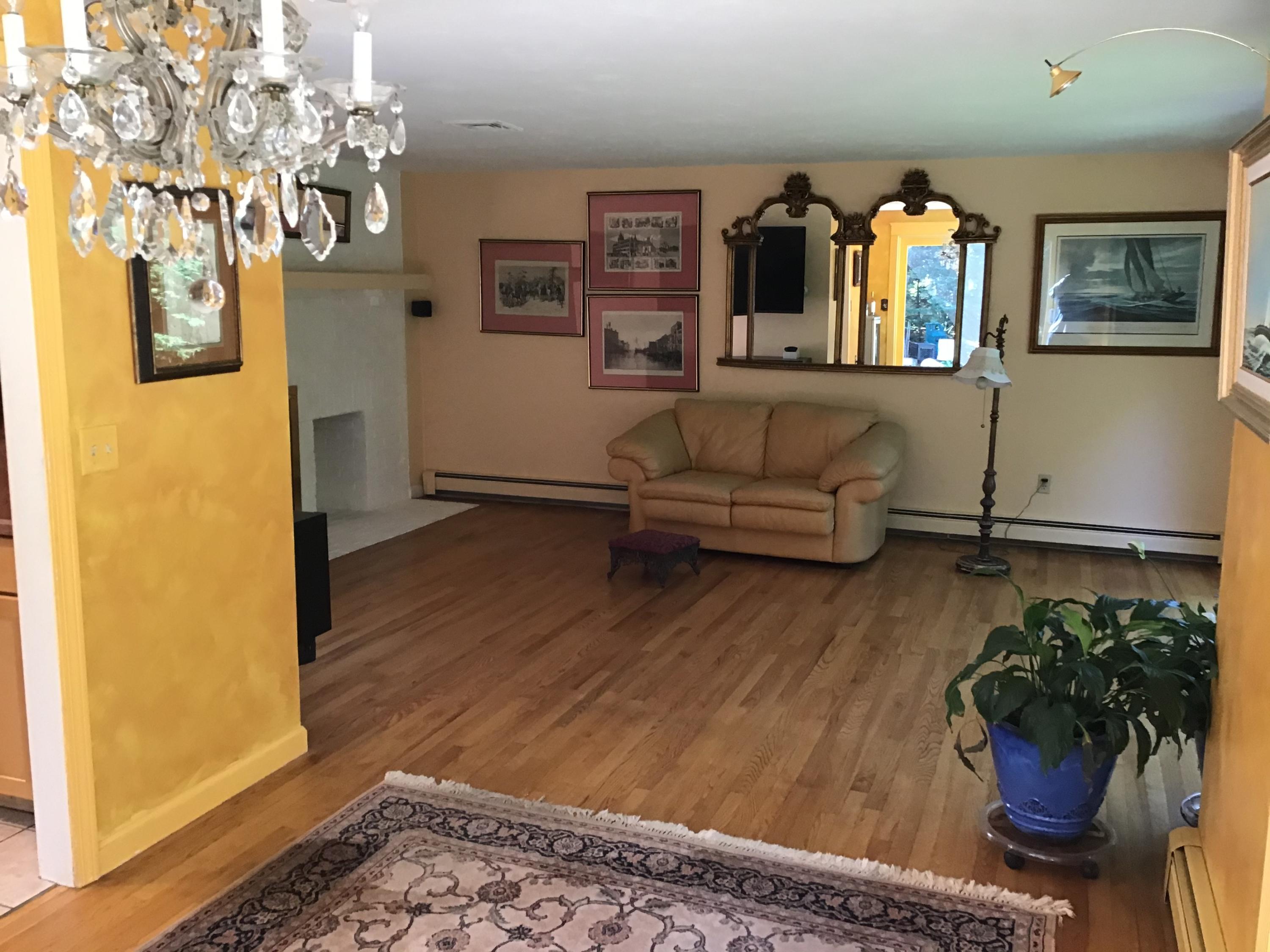 114 Sullivan Road West Yarmouth, MA 02673 - Photo 20 of 41 a living room with furniture and wooden floor
