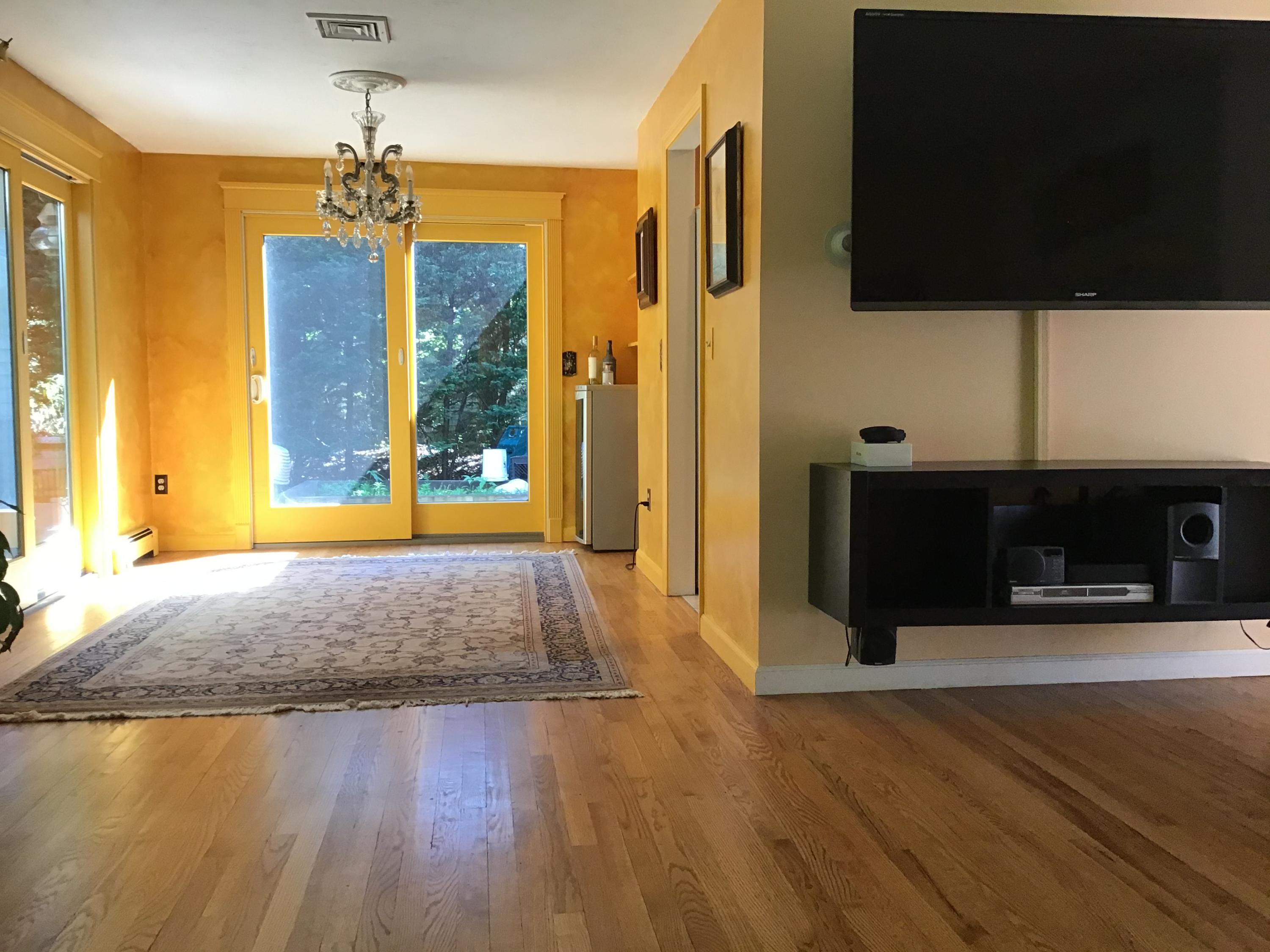114 Sullivan Road West Yarmouth, MA 02673 - Photo 23 of 41 a view of hallway with wooden floor and fireplace