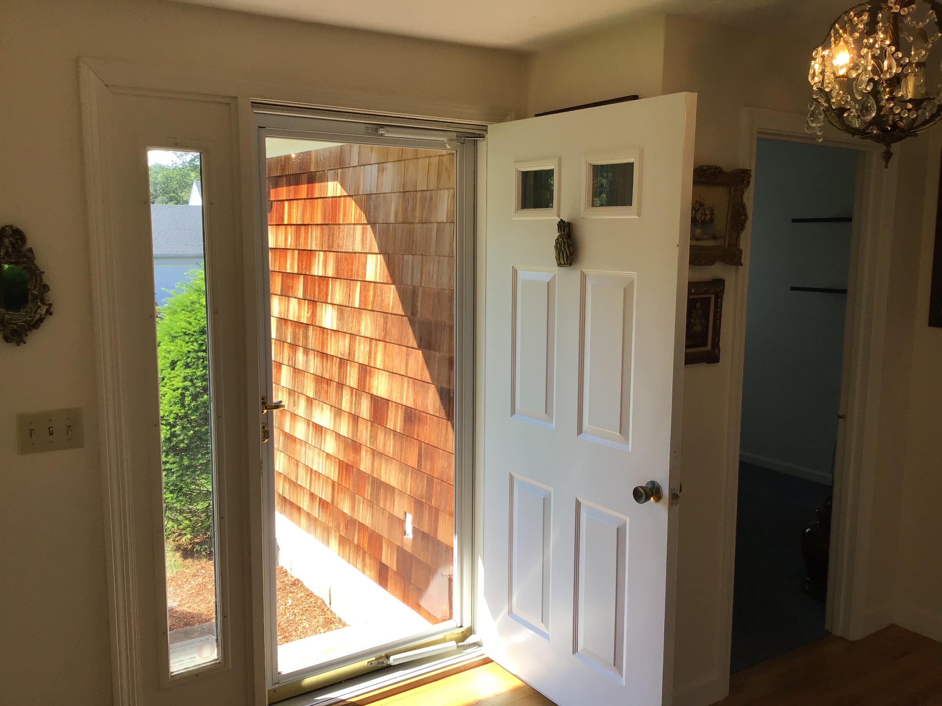 114 Sullivan Road West Yarmouth, MA 02673 - Photo 25 of 41 a view of a living room with a large window and front door