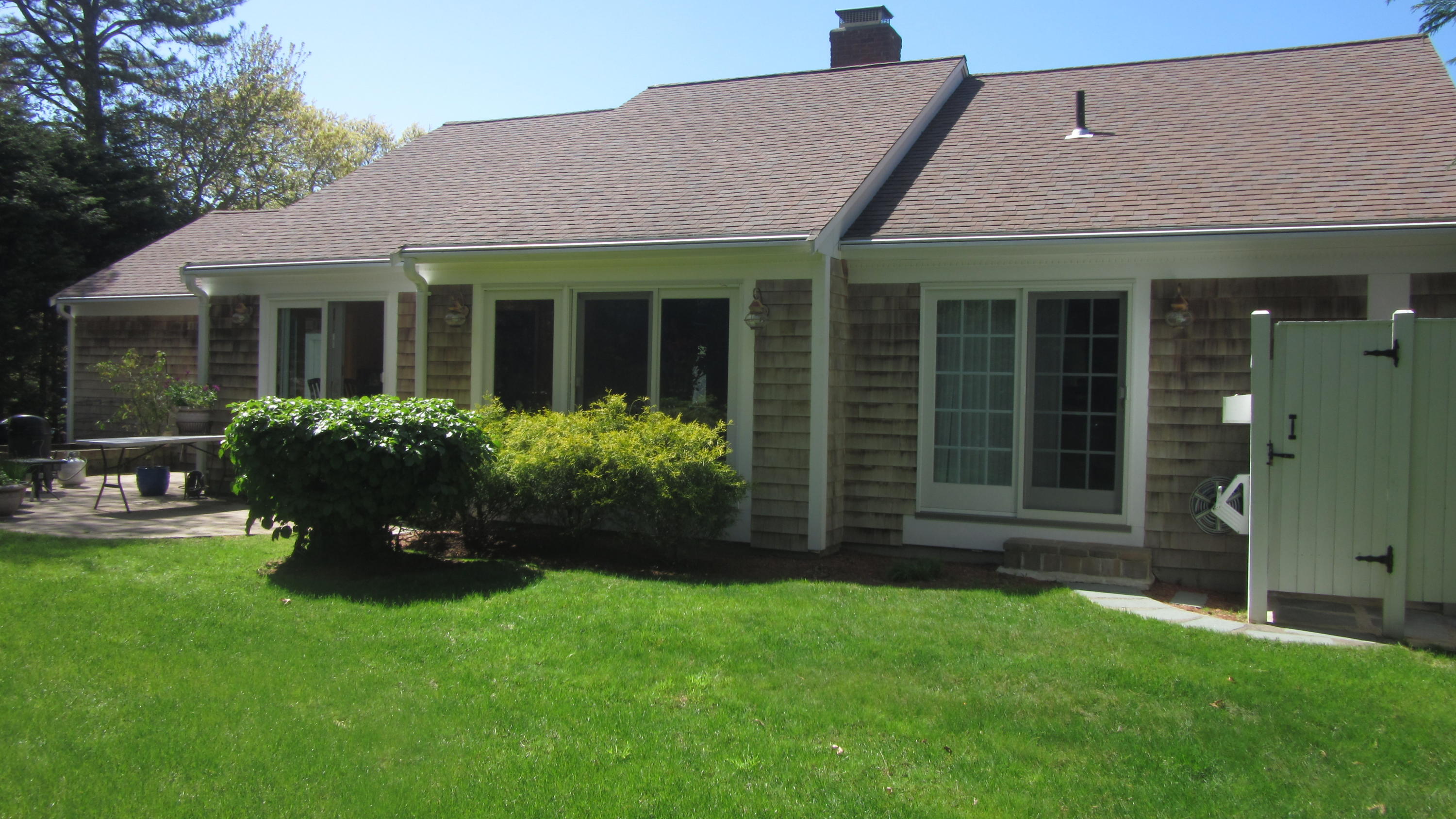 114 Sullivan Road West Yarmouth, MA 02673 - Photo 3 of 41 a front view of a house with a garden