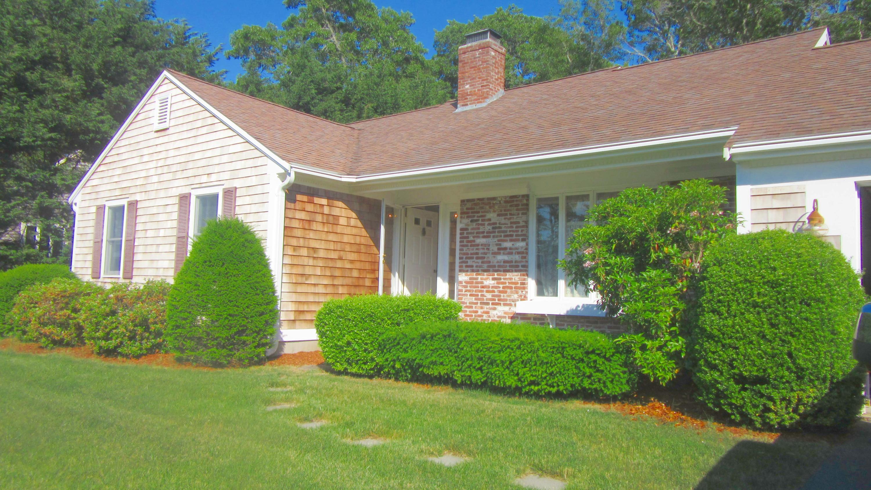 114 Sullivan Road West Yarmouth, MA 02673 - Photo 5 of 41 a view of a house with a yard and plants