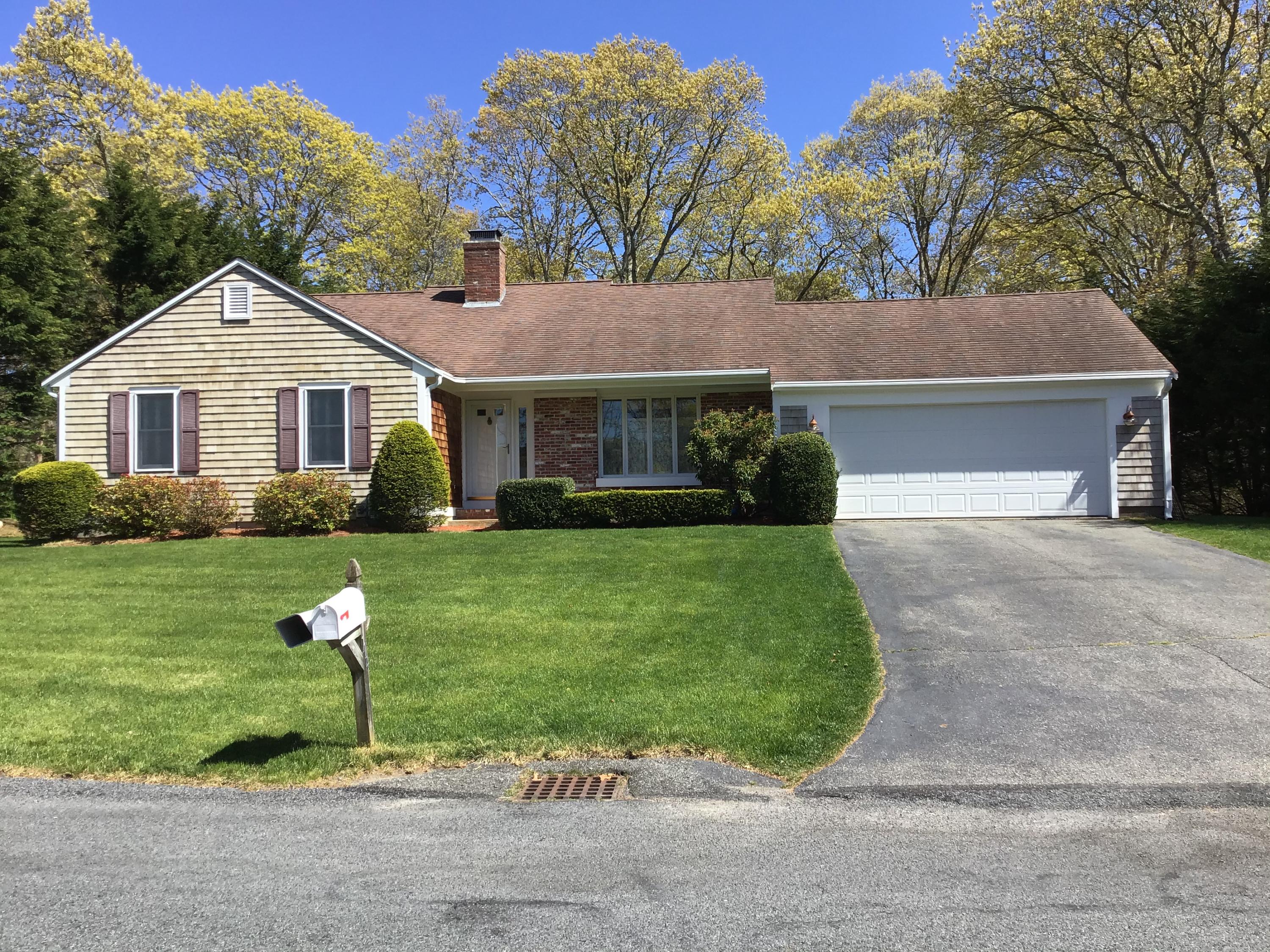 114 Sullivan Road West Yarmouth, MA 02673 - Photo 6 of 41 a front view of a house with a yard
