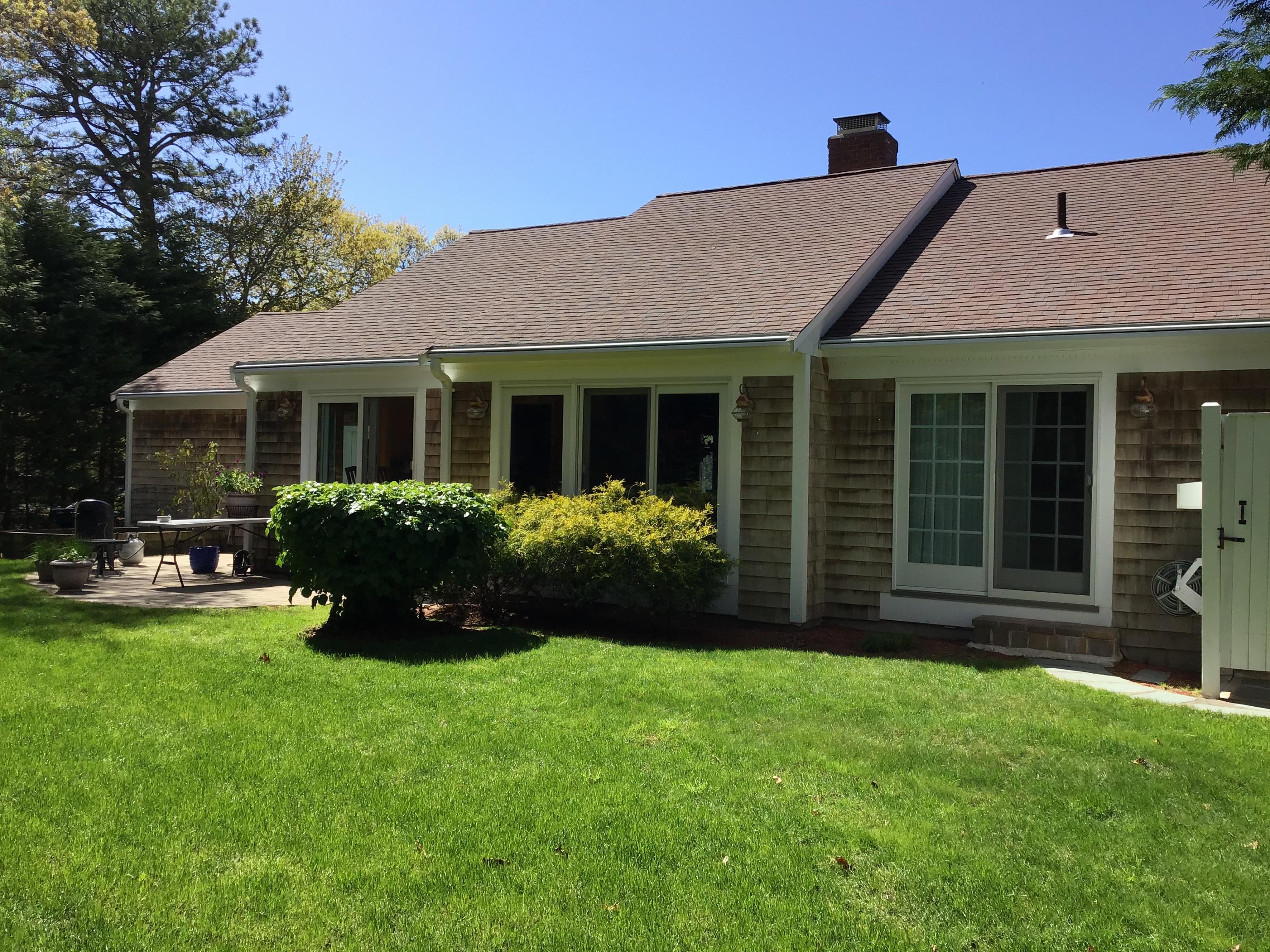 114 Sullivan Road West Yarmouth, MA 02673 - Photo 8 of 41 a view of a house with a garden