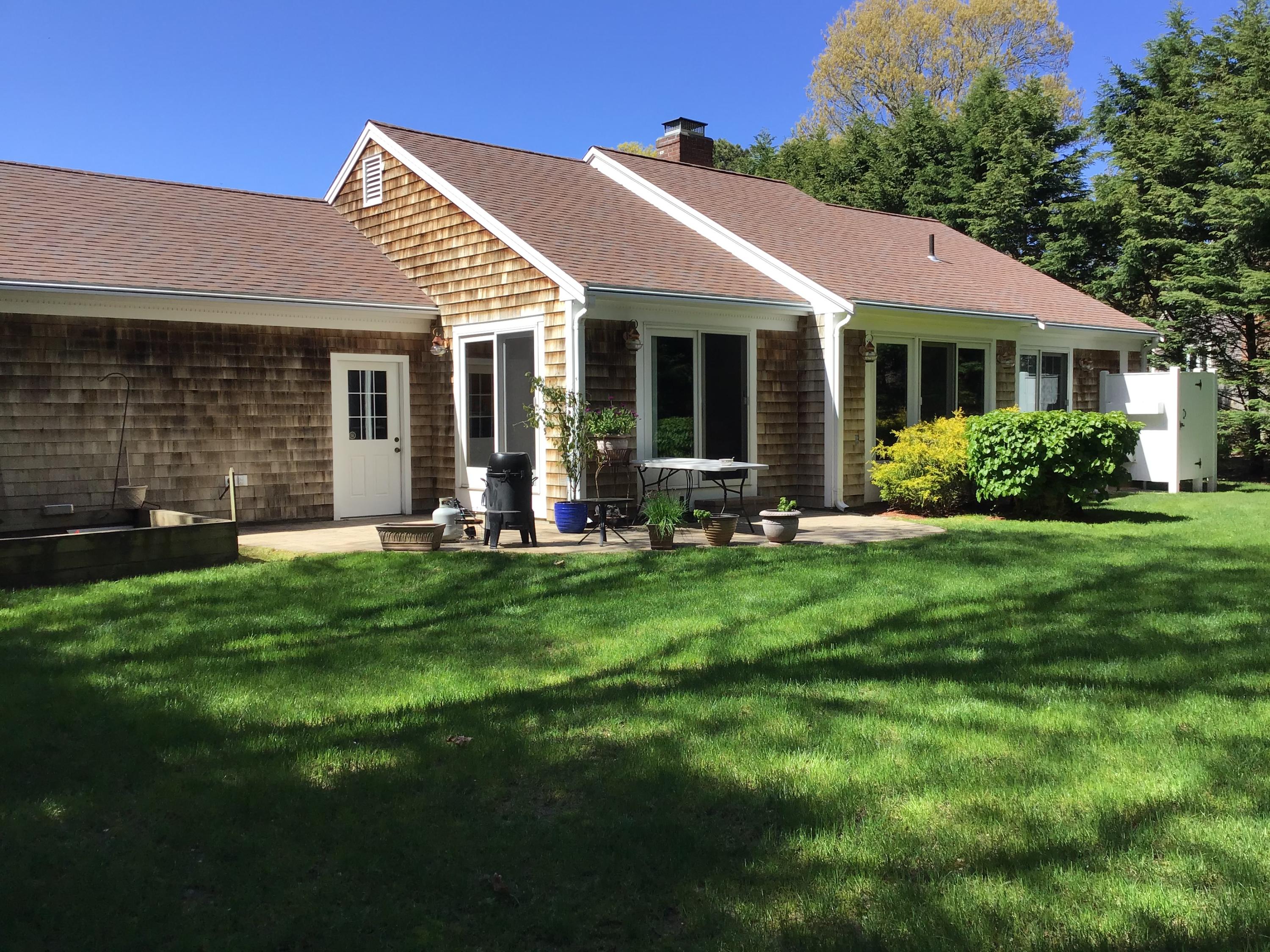 114 Sullivan Road West Yarmouth, MA 02673 - Photo 9 of 41 front view of a house with a yard