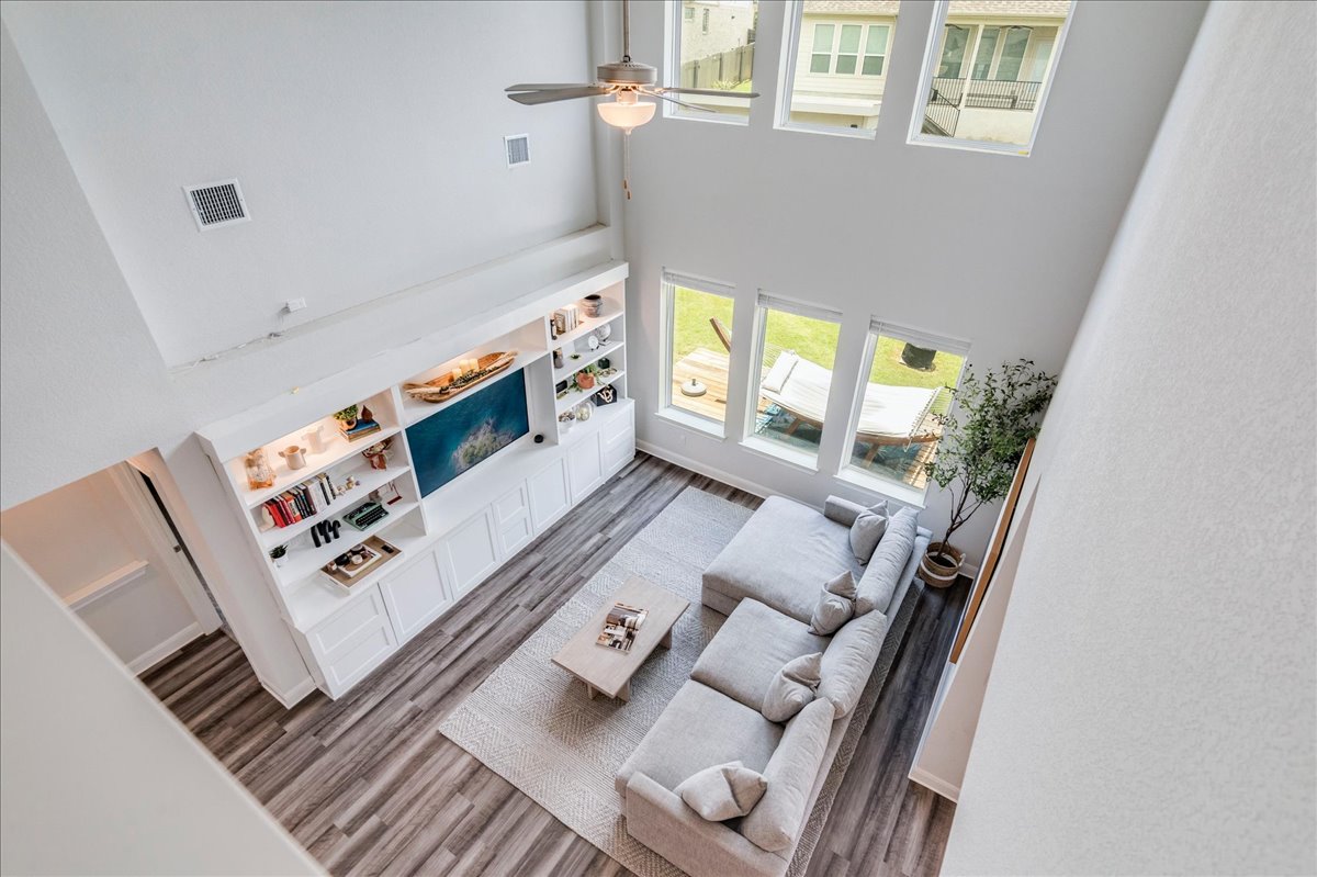 212 Sierra Blanca Road Dripping Springs, TX 78620 - Photo 14 of 37 Living room with tall ceilings and built ins.