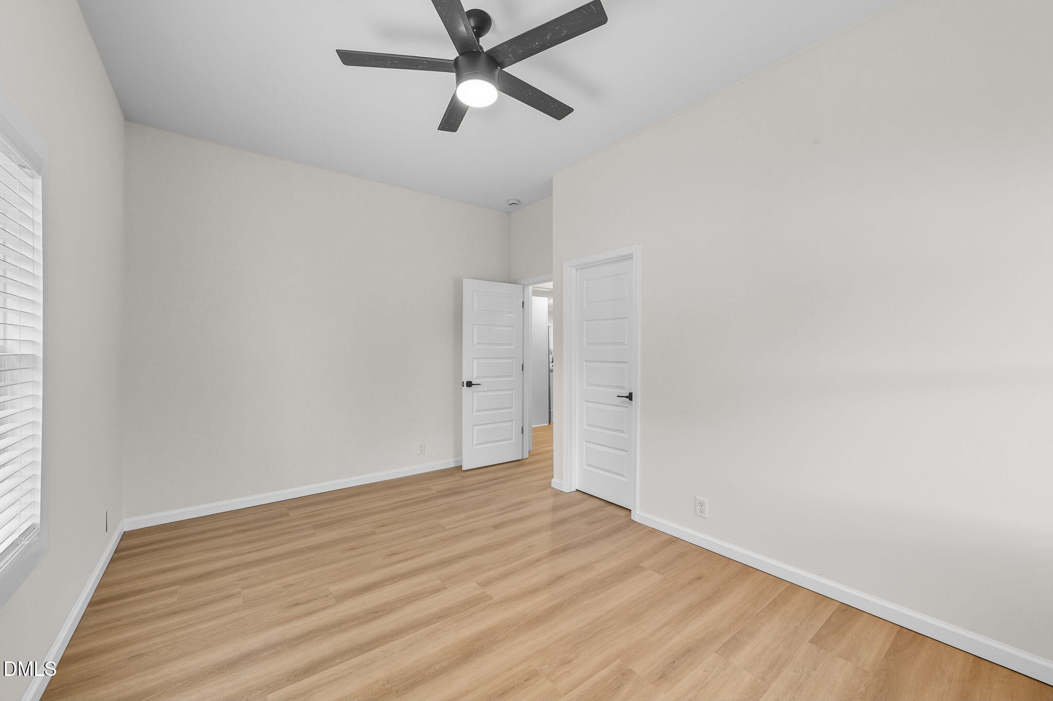 303 West 2nd Street Clayton, NC 27520 - Photo 13 of 44 a view of empty room with wooden floor