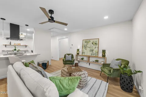 a living room with furniture and a rug