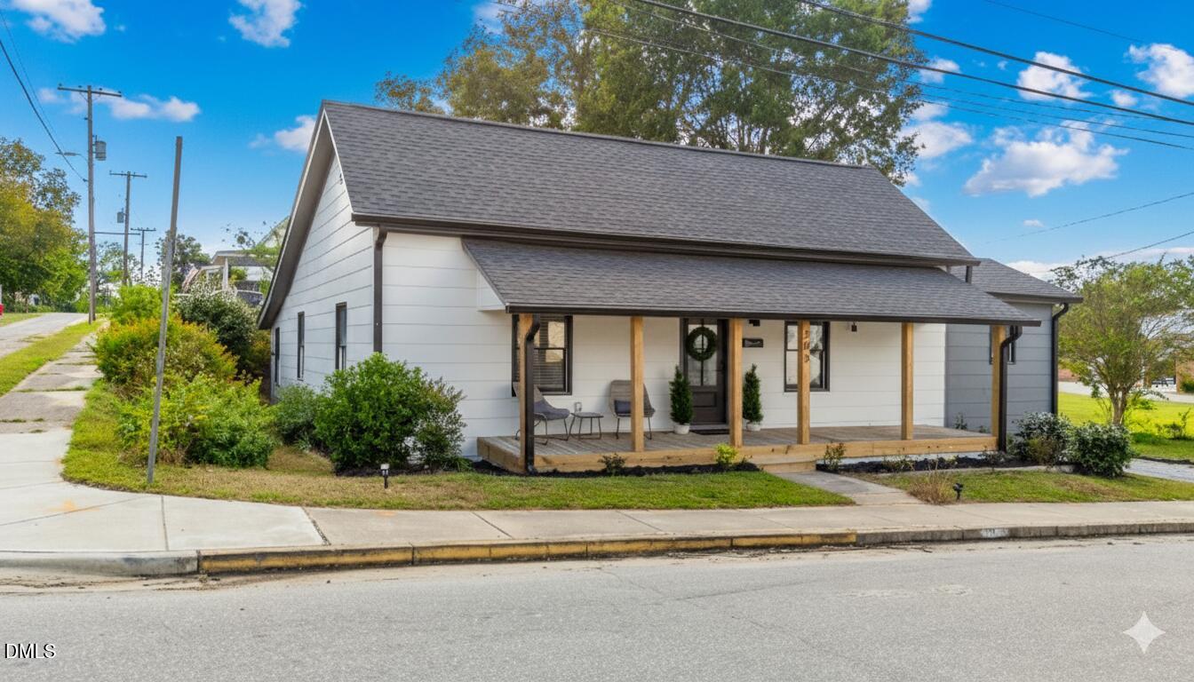 303 West 2nd Street Clayton, NC 27520 - Photo 2 of 44 a house view with a garden space
