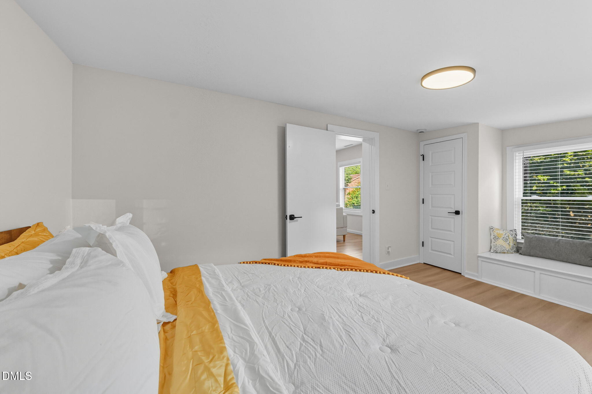 303 West 2nd Street Clayton, NC 27520 - Photo 33 of 44 a bedroom with a bed and a window