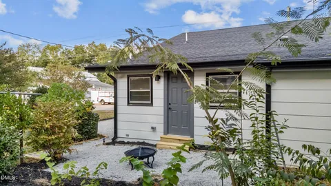 a view of a house with a backyard