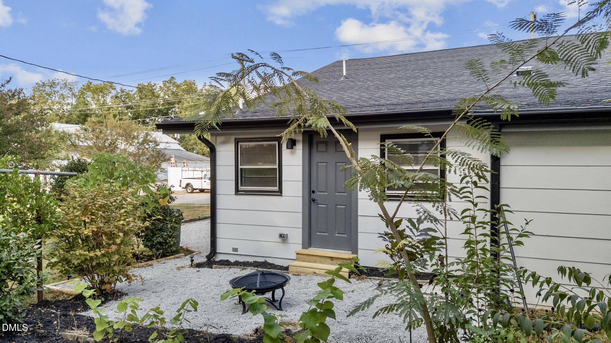 303 West 2nd Street Clayton, NC 27520 - Photo 40 of 44 a front view of a house with a yard