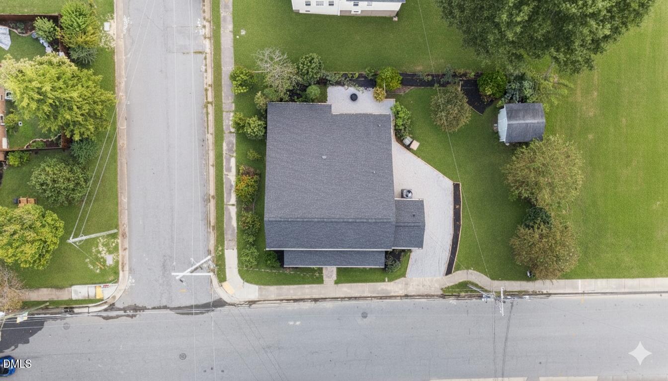 303 West 2nd Street Clayton, NC 27520 - Photo 41 of 44 an aerial view of a house with a yard and large tree