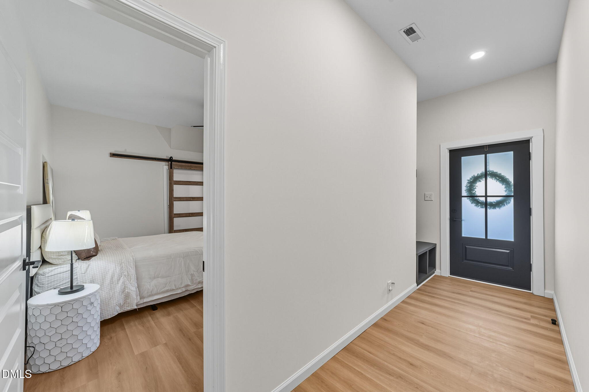 303 West 2nd Street Clayton, NC 27520 - Photo 5 of 44 a bedroom with a bed and wooden floor
