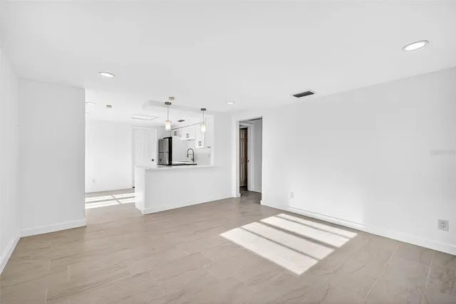 a kitchen with stainless steel appliances granite countertop a stove and a refrigerator