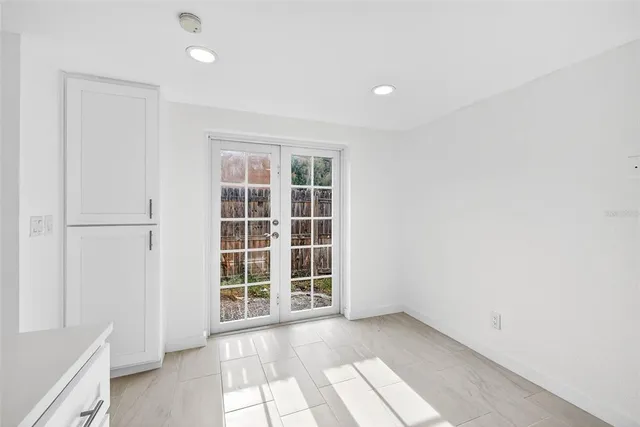 an empty room with wooden floor