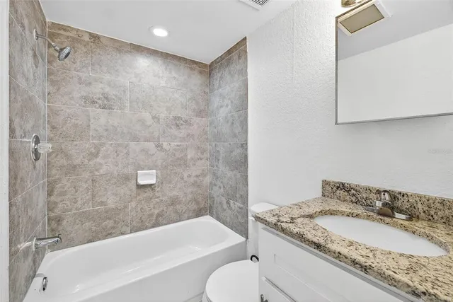 walk in closet with view of living room