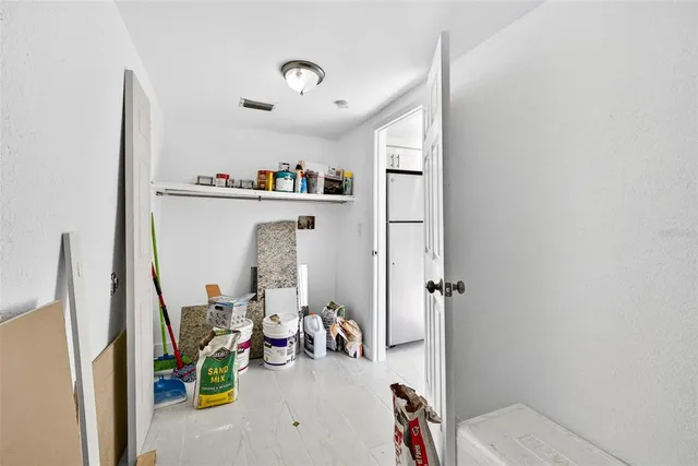 a kitchen with stainless steel appliances a refrigerator and a stove