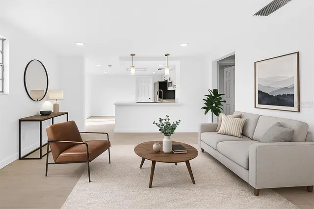 a bedroom with a bed and a potted plant