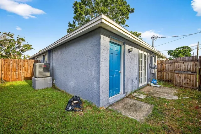 a view of kitchen and hall with wooden floor