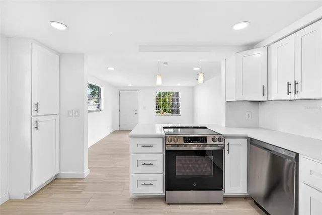 a view of a kitchen cabinets and wooden floor