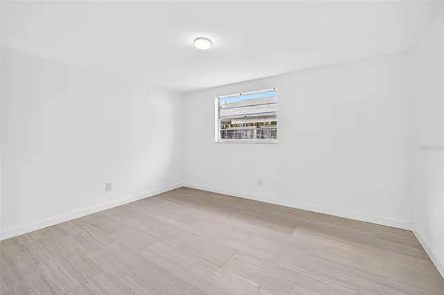 an aerial view of a house with a garden and yard