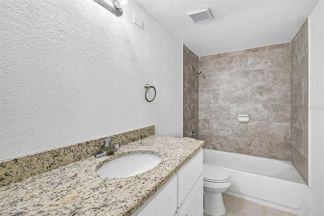 an aerial view of city and lake