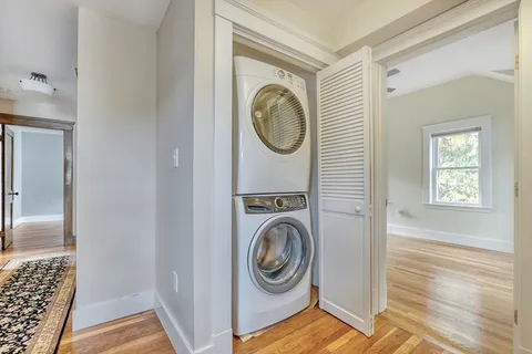 a view of storage and utility room with washer and dryer