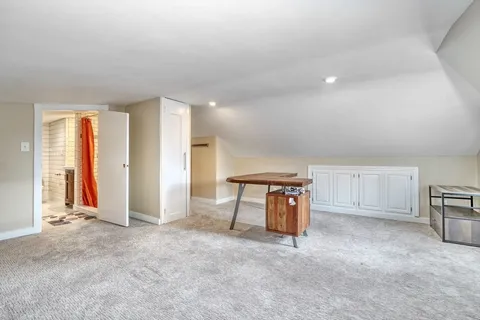 a view of an empty room with closet area