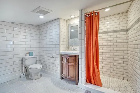 a bathroom with a toilet and a sink