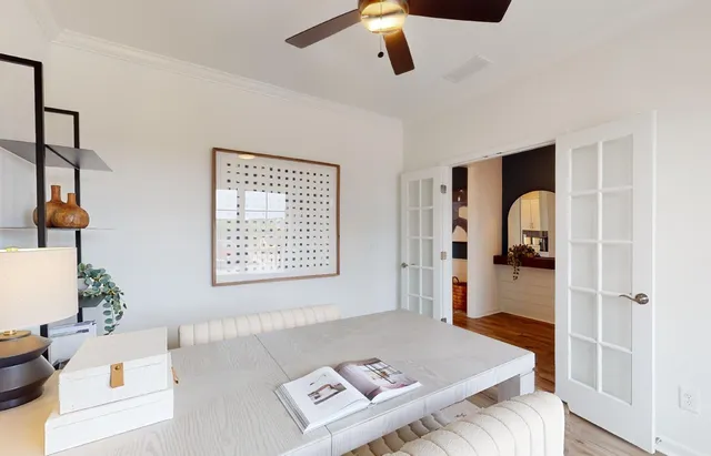 a living room with a couch and a window