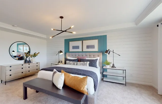 a bedroom with a bed window and a dresser