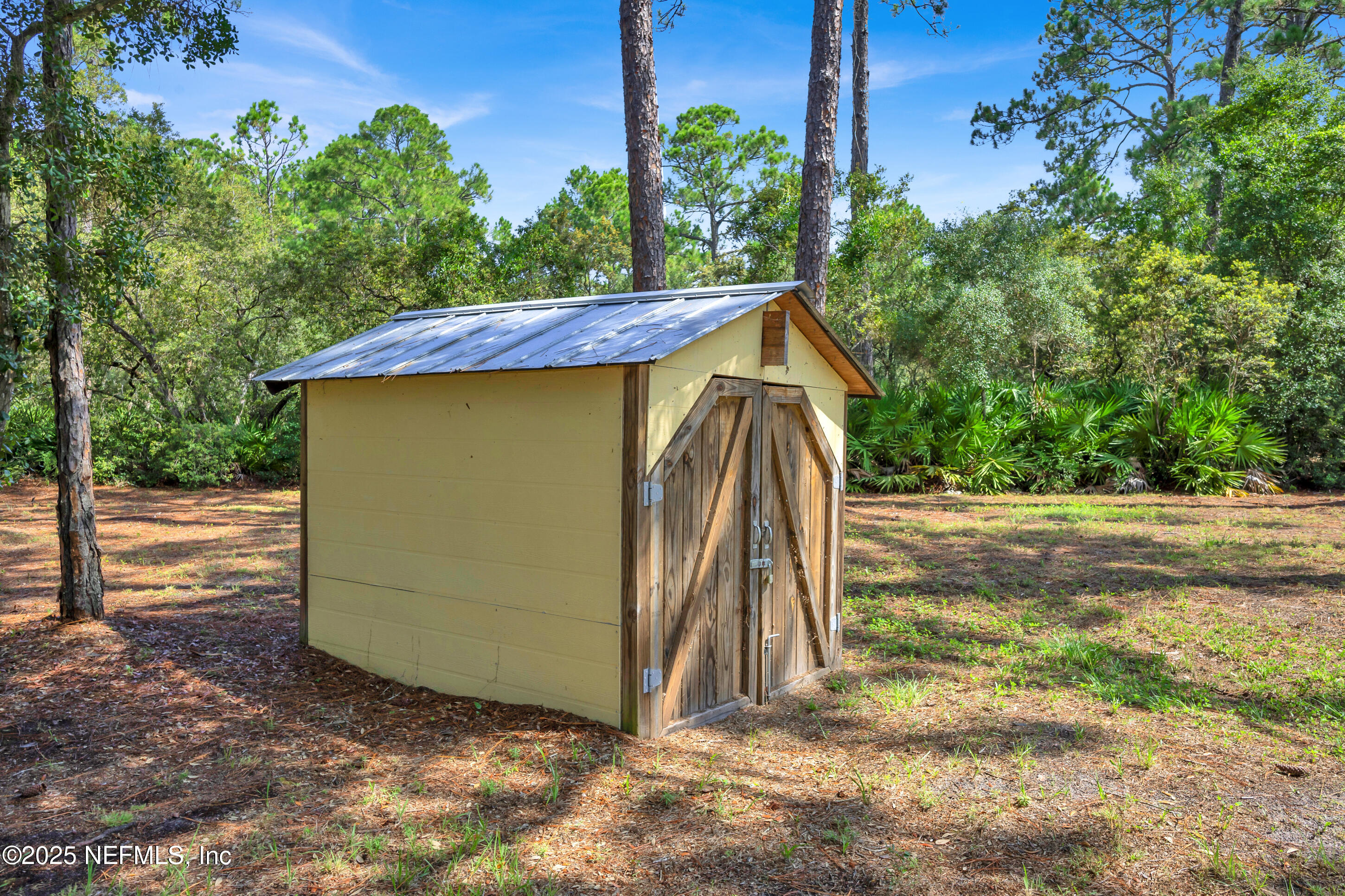13091 Sawpit Road Jacksonville, FL 32226 - Photo 11 of 26 a view of a house with backyard and trees