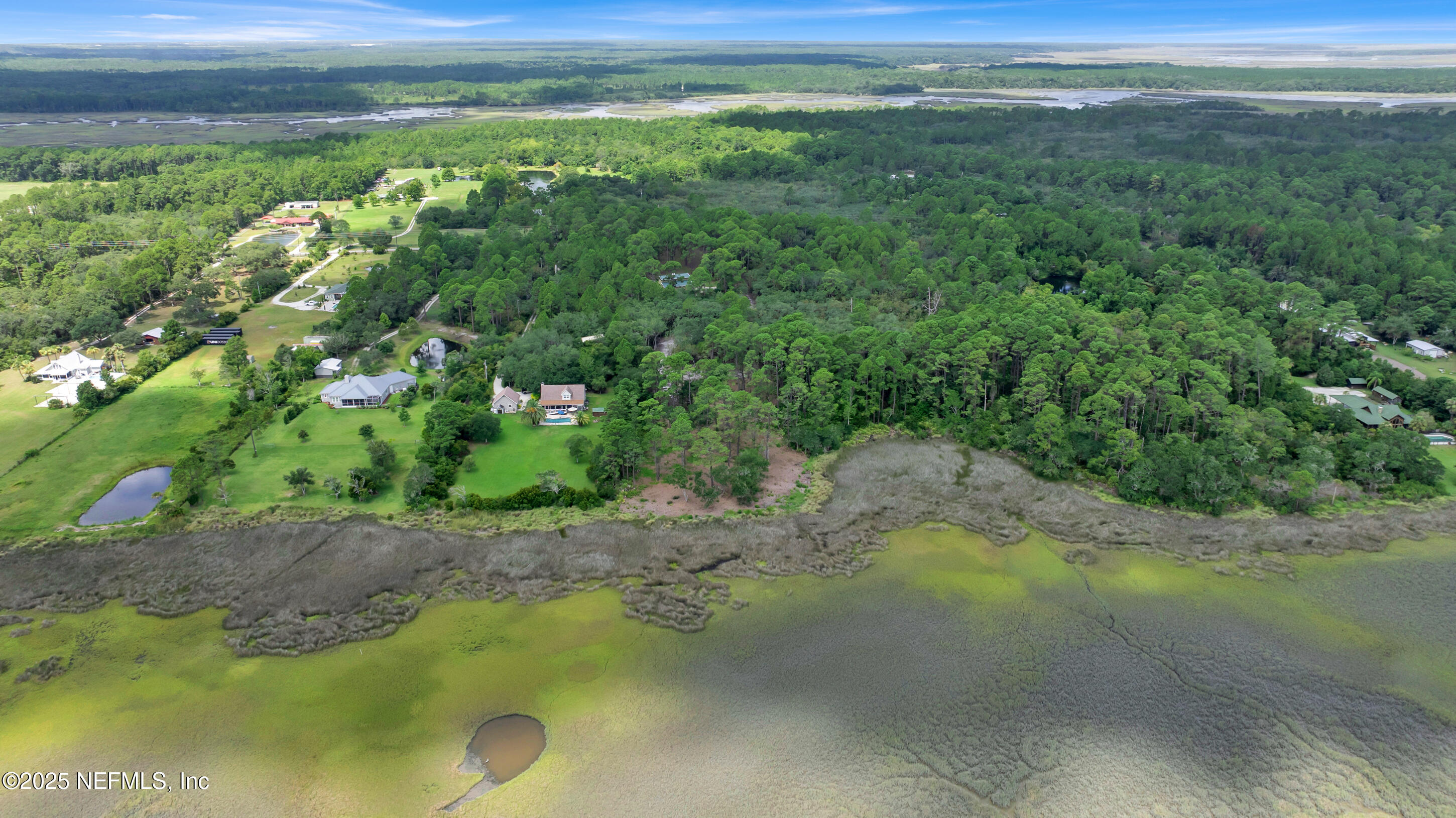 13091 Sawpit Road Jacksonville, FL 32226 - Photo 22 of 26 a view of a lake with beach and outdoor space