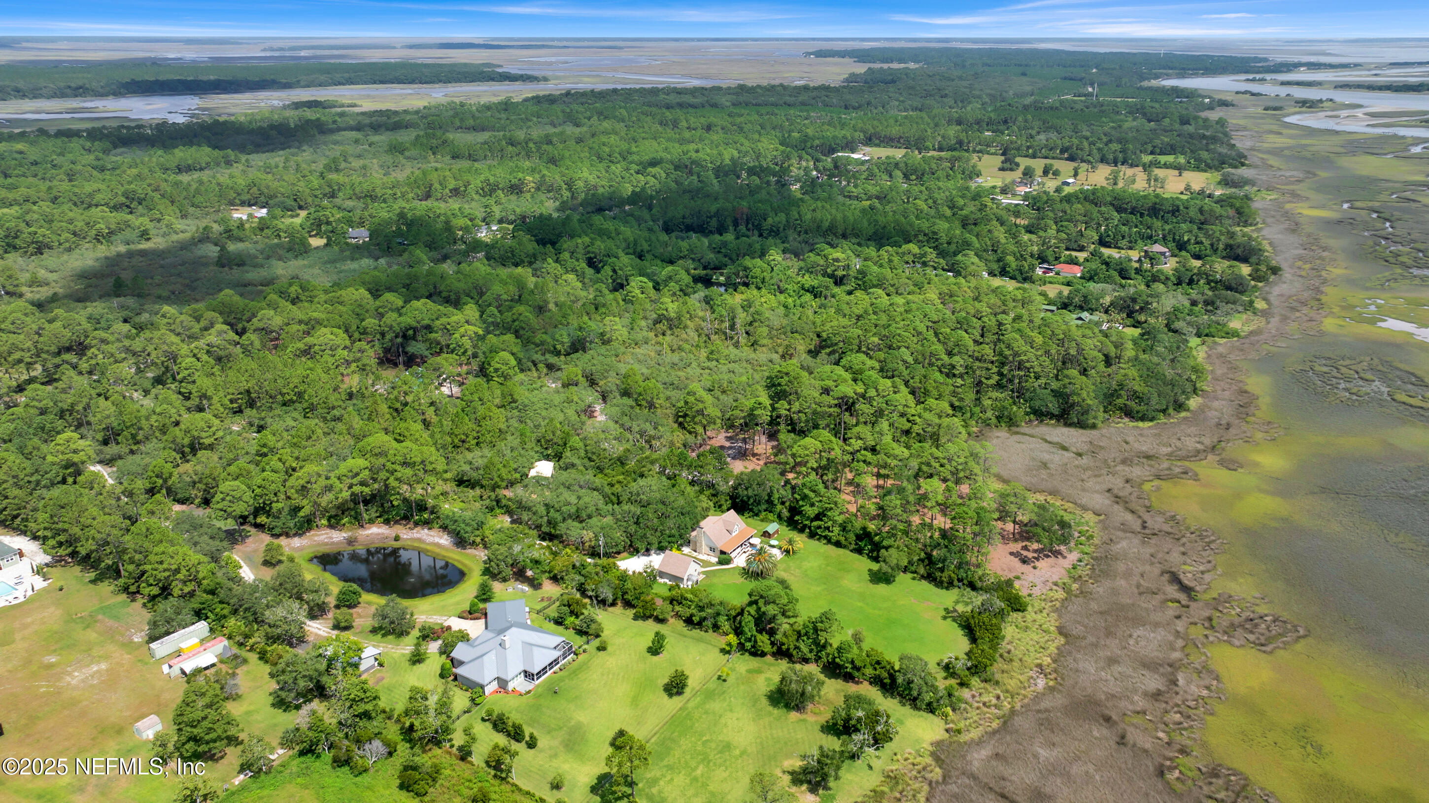 13091 Sawpit Road Jacksonville, FL 32226 - Photo 25 of 26 a view of a field with a tree