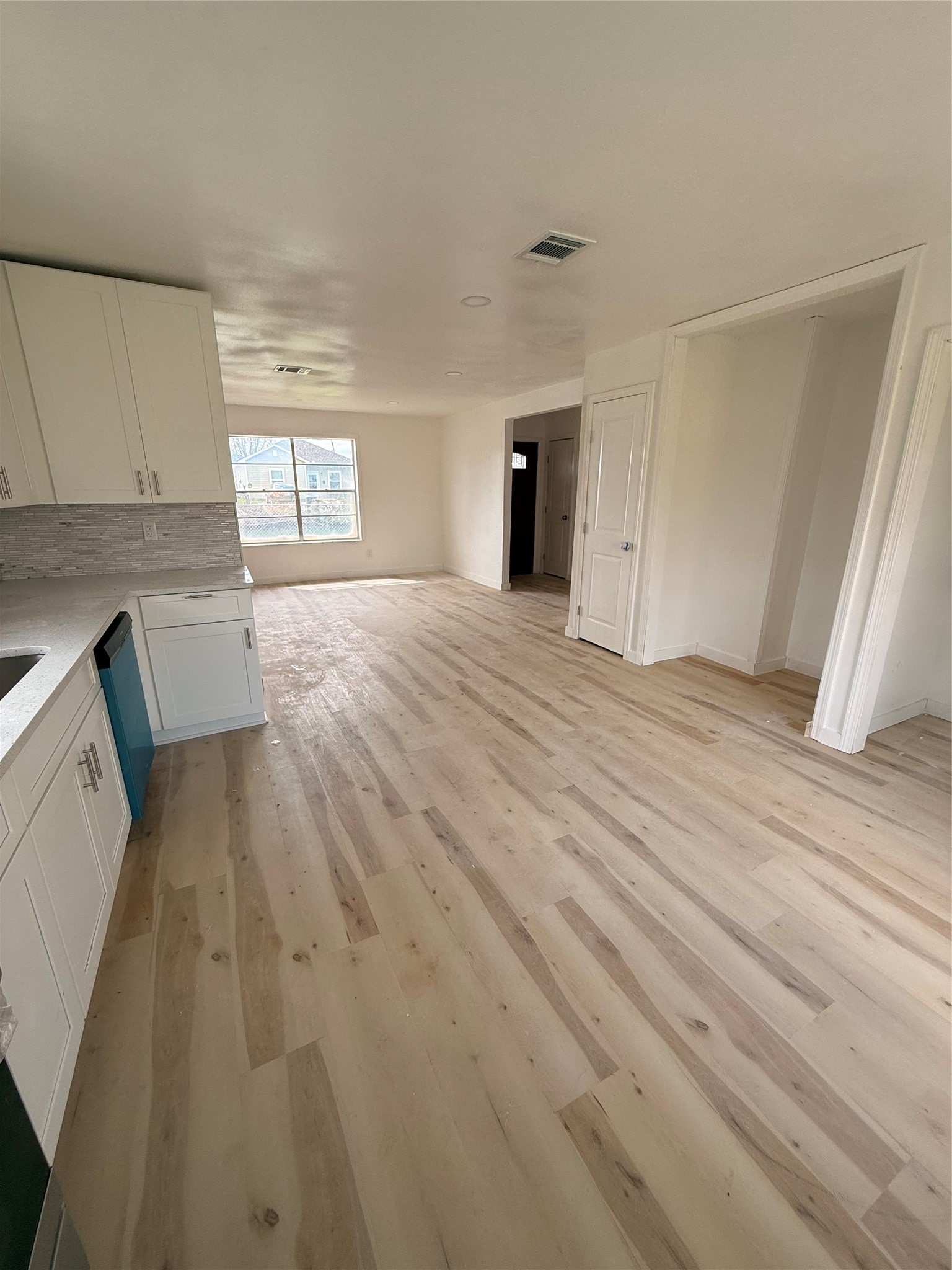 8015 Howton Street Houston, TX 77028 - Photo 11 of 11 a view of empty room with wooden floor and fan