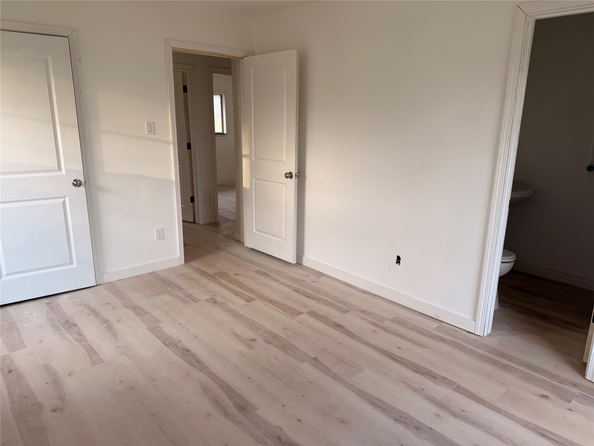 8015 Howton Street Houston, TX 77028 - Photo 4 of 11 a view of empty room with wooden floor and closet