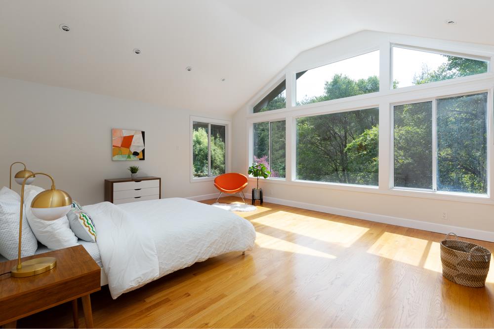 4399 Porter Gulch Road Aptos, CA 95003 - Photo 11 of 32 a bedroom with furniture and a large window