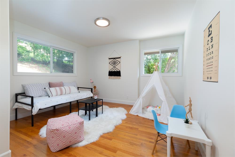 4399 Porter Gulch Road Aptos, CA 95003 - Photo 16 of 32 a living room with furniture and a large window