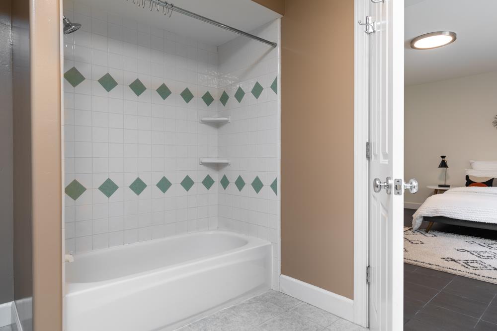 4399 Porter Gulch Road Aptos, CA 95003 - Photo 23 of 32 a bathroom with a bathtub and a shower