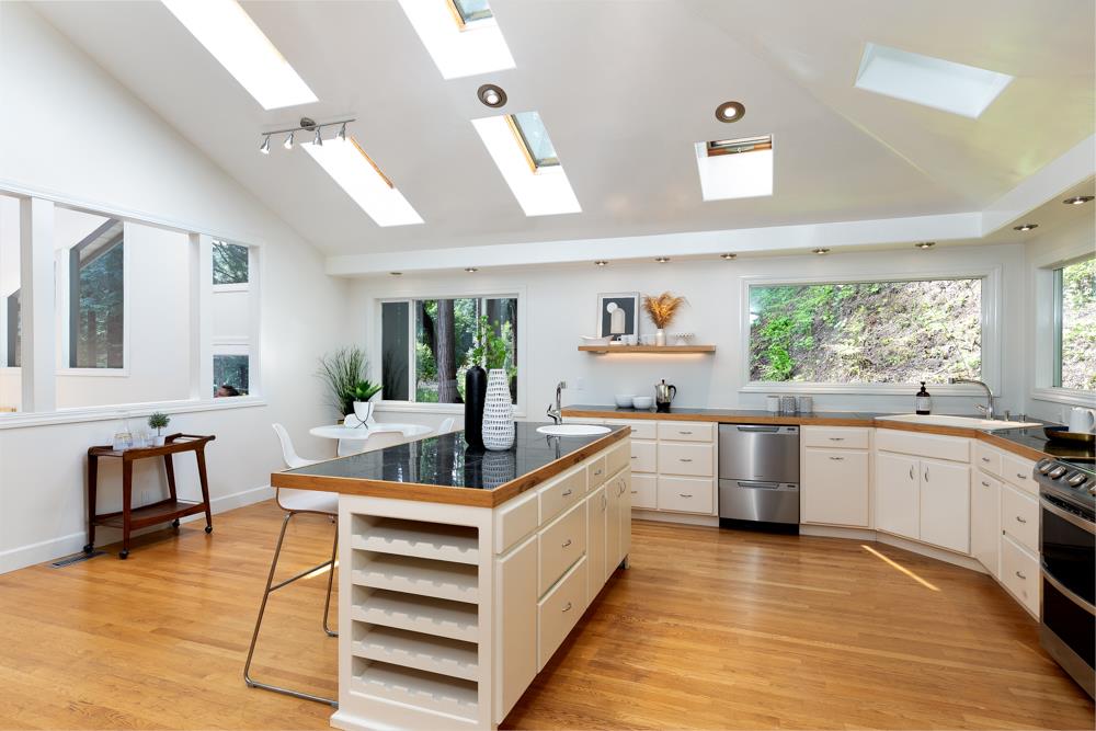 4399 Porter Gulch Road Aptos, CA 95003 - Photo 9 of 32 a kitchen with sink cabinets and wooden floor