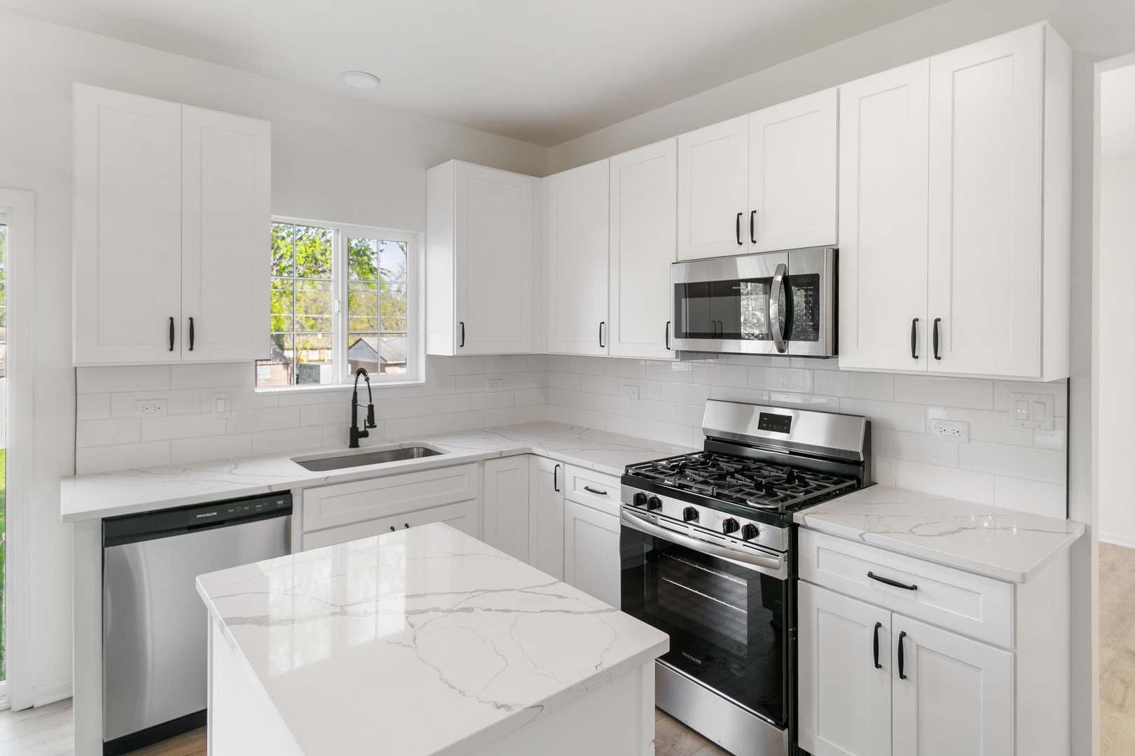 729 Wright Road University Park, IL 60484 - Photo 3 of 27 a kitchen with cabinets appliances a sink and a window