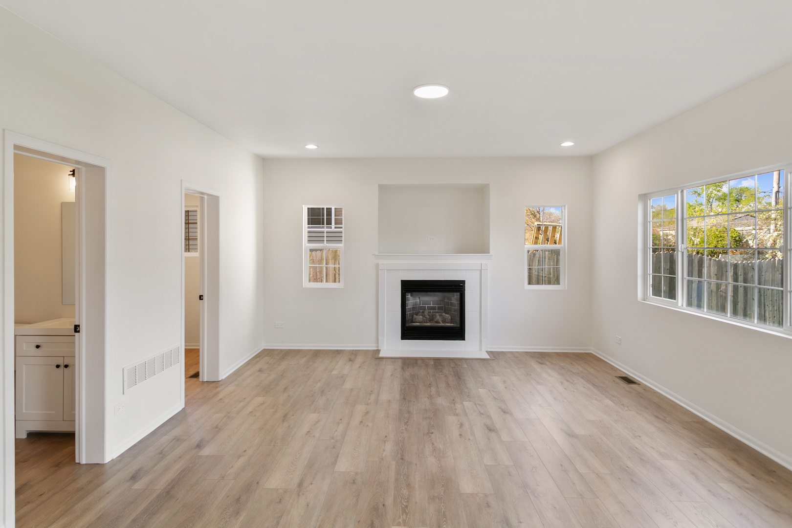 729 Wright Road University Park, IL 60484 - Photo 6 of 27 an empty room with windows and fireplace