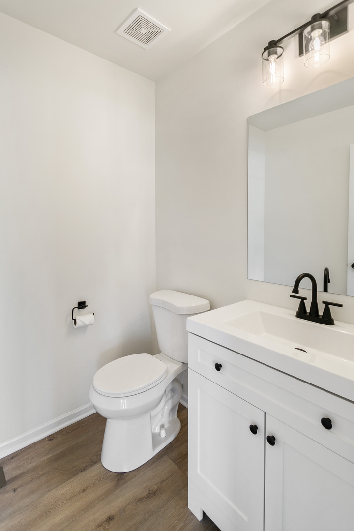729 Wright Road University Park, IL 60484 - Photo 8 of 27 a bathroom with a sink a toilet and a mirror