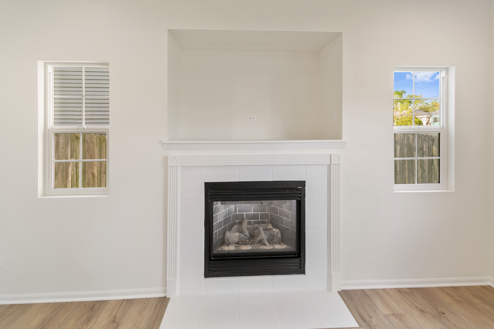 729 Wright Road University Park, IL 60484 - Photo 10 of 27 a living room with a fireplace and a window