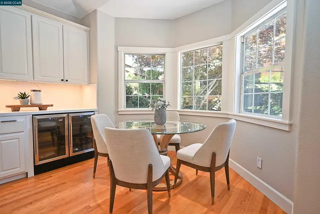 a dining room with furniture and windows
