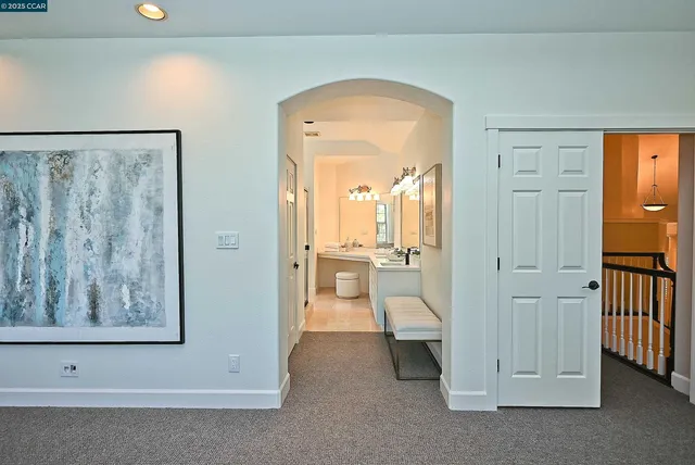 a view of a hallway view with three rooms