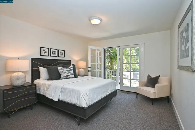 a bedroom with a bed and a couch