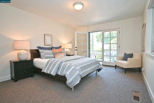 a spacious bedroom with a bed and a couch